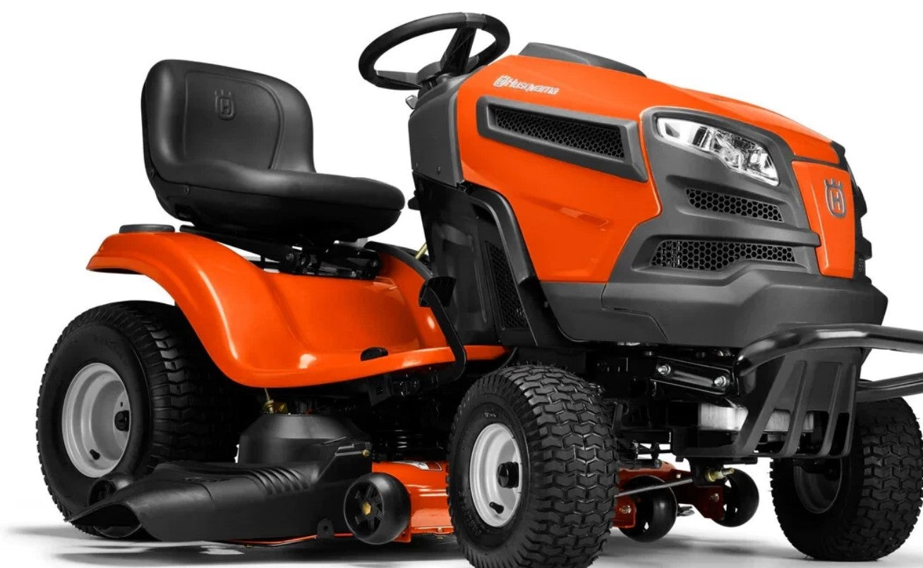 Orange and black lawn mower on a white background