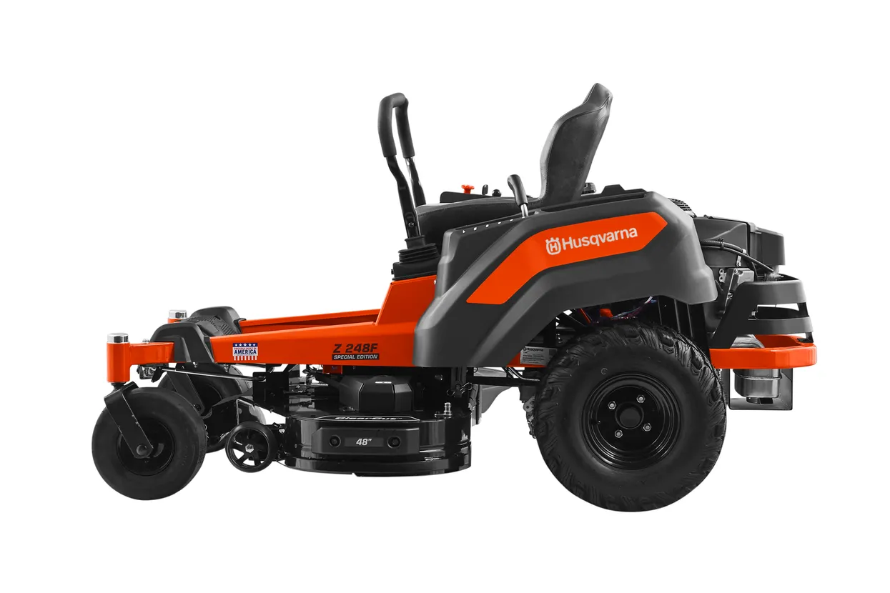 Orange and black Husqvarna zero-turn lawn mower on a white background