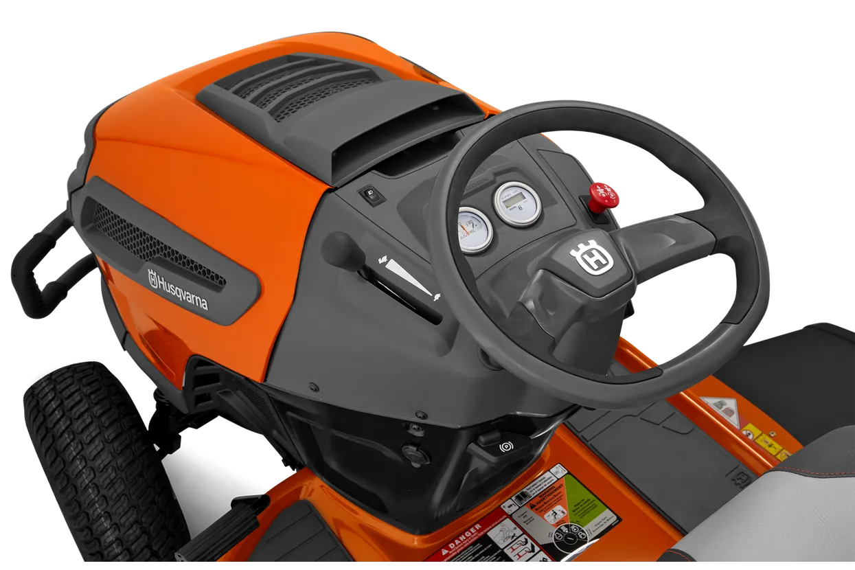 Orange and black lawn mower with steering wheel on a white background
