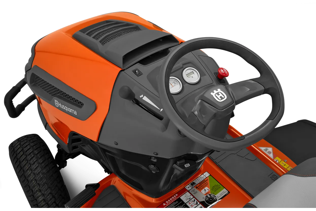 Orange and black lawn mower with steering wheel on a white background
